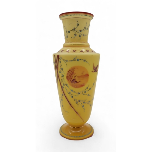 211 - A Victorian yellow ground glass vase, decorated in brown and blue with birds and flowering vines, 32... 