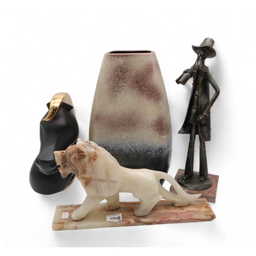 220 - A West German vase, of compressed form, in naturalistic colours, a carved hardstone figure of a lion... 