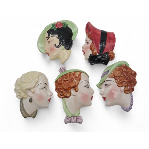 228 - A collection of Art Deco pottery wall masks, one marked by C & Co and another C Ltd, England, No... 