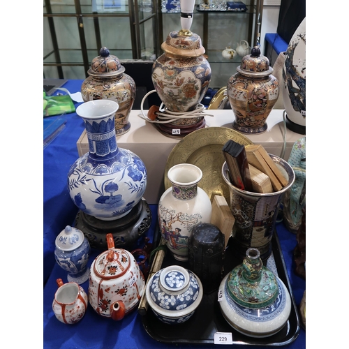 229 - A collection of oriental ceramics including two blue and white crackleware bowls and coverts, a resi... 