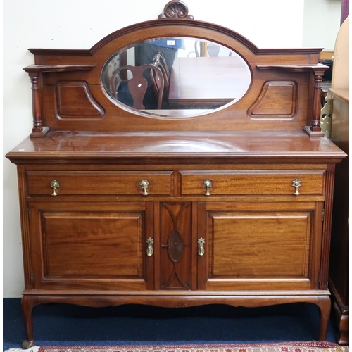 23 - A 20th century mahogany mirror backed sideboard with a pair of drawers over cabinet doors on turned ... 