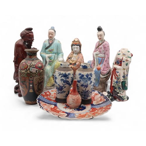 230 - A collection of oriental ceramics including porcelain figures, a Japanese geisha figure (af), a carv... 