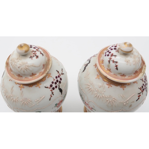 231 - A pair of Samson armorial vases and covers, in the Chinese export style, along with another vase, wi... 