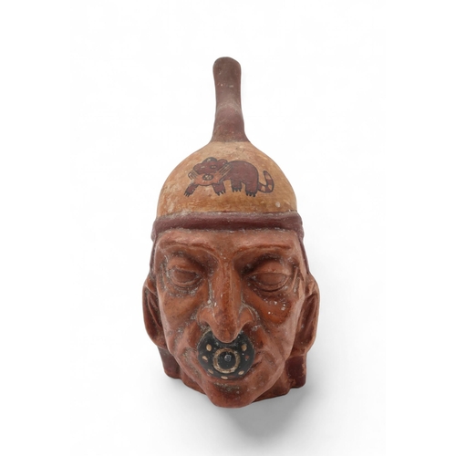 233 - A moche portrait vessel, in the Pre-Colombian style, 29cm high