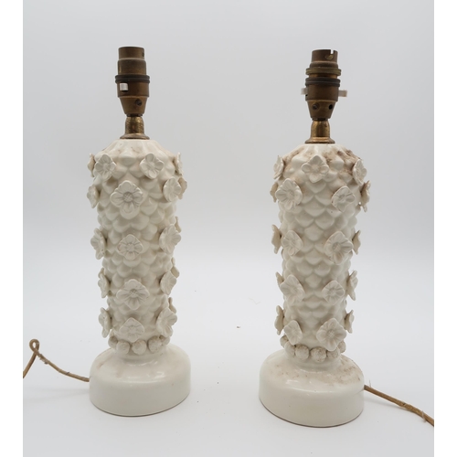 242 - A pair of Casa Pupo lamps, with raised decoration of flowers, a neoclassical brass lamp, modelled as... 