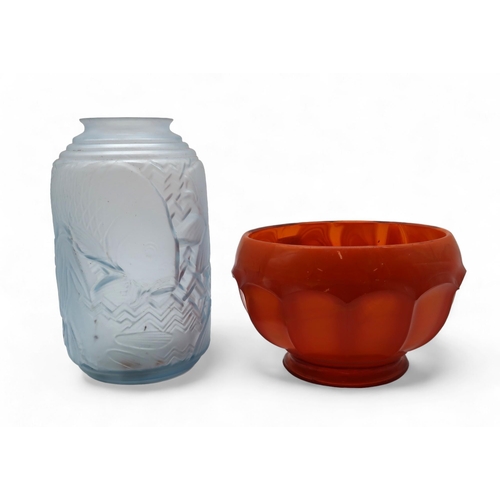 284 - A orange cloud glass bowl together with a pale blue pressed glass vase depicting fish
