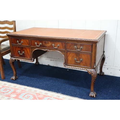 4 - A lot comprising a 20th century mahogany desk with embossed writing skiver over central drawer flank... 