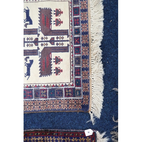 43 - A cream ground tribal style rug with geometric patterned ground within multicoloured border, 147cm l... 