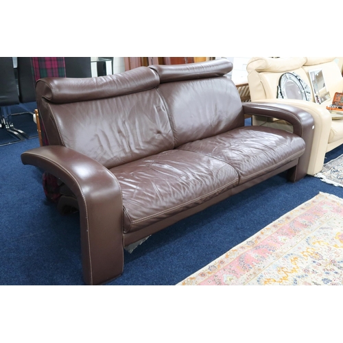 49 - A 20th century after Ake Fribytter two seater chocolate leather upholstered settee, 90cm high x 214c... 