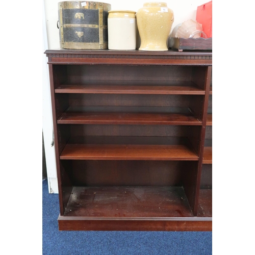 54 - A 20th century mahogany open bookcase with dentil corniced top over six open shelves on plinth base,... 