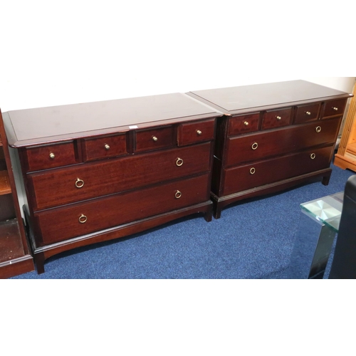 56 - A pair of mid 20th century Stag Minstrel chests of drawers, each with four short over two long drawe... 