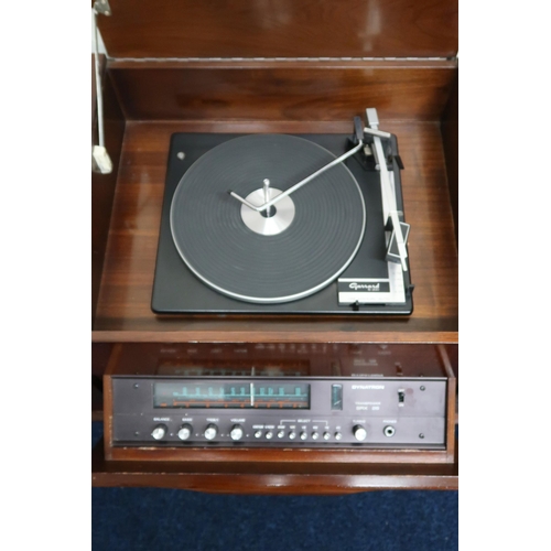 66 - A mid 20th century stained teak Dynatron radiogram with Garrard turntable, 64cm high x 140cm wide x ... 