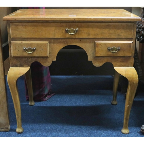 7 - A 19th century burr walnut veneered lowboy with rectangular top over single long drawer over two sho... 