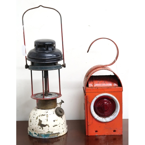 70 - A lot comprising a 20th century Chalwyn stamped metal railway lantern and a Bialaddin model 300X til... 