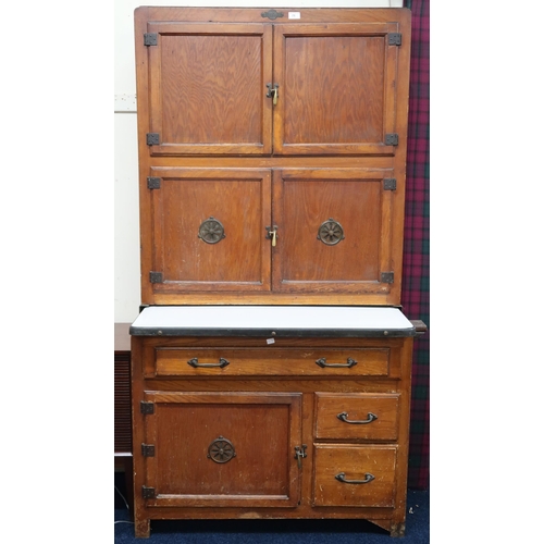 71 - A late 19th/early 20th century Hygena larder/kitchen cabinet with two pairs of cabinet doors over sl... 