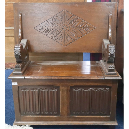 72 - A 20th century stained oak metamorphic monks bench with rectangular top/back on carved lion form arm... 