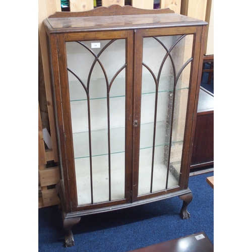 78 - An early 20th century oak two door glazed display cabinet on ball and claw supports, 125cm high x 79... 