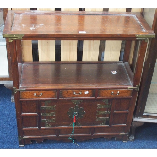 81 - A 20th century Oriental side cabinet with rectangular top over open tier over three short drawers ov... 