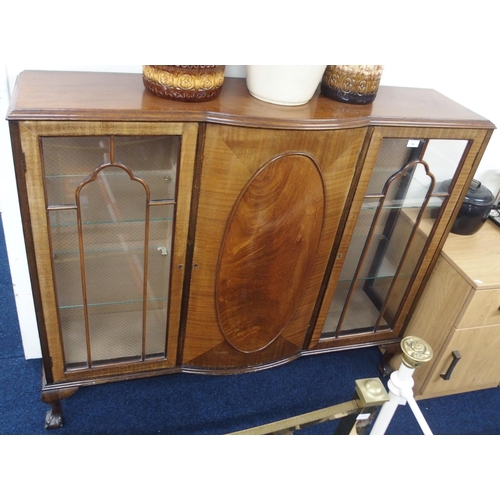 94 - A 20th century mahogany display cabinet with central bow fronted door flanked by glazed doors on bal... 