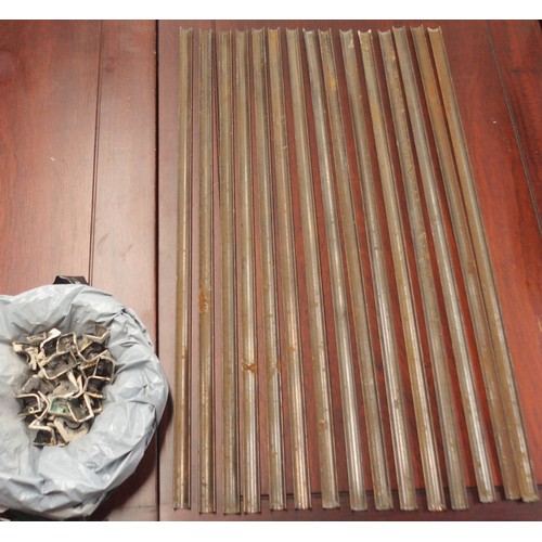 34 - A lot of fifteen 19th century copper stair carpet rails/rods 73cm wide with fittings