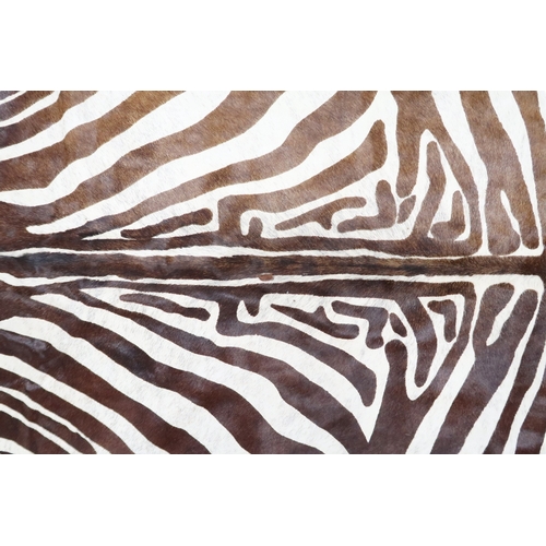 2179 - A 20TH CENTURY ZEBRA PATTERNED COW HIDE RUG 211cm long x 187cm wide (measured from widest points)... 