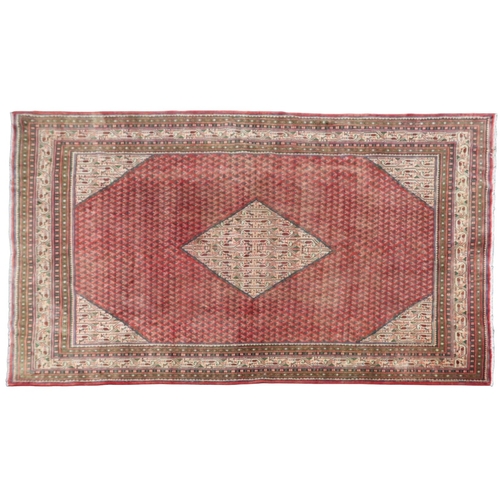 2180 - A RED GROUND ARAAK BOTTEH DESIGN RUG with cream geometric patterned diamond central medallion and ma... 