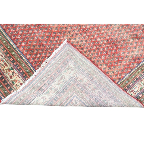 2180 - A RED GROUND ARAAK BOTTEH DESIGN RUG with cream geometric patterned diamond central medallion and ma... 