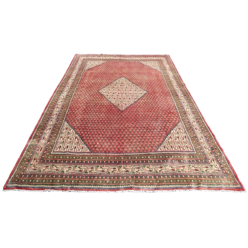 2180 - A RED GROUND ARAAK BOTTEH DESIGN RUG with cream geometric patterned diamond central medallion and ma... 