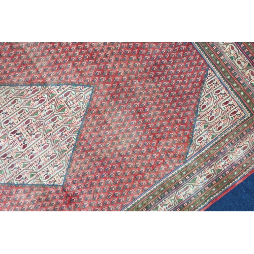 2180 - A RED GROUND ARAAK BOTTEH DESIGN RUG with cream geometric patterned diamond central medallion and ma... 