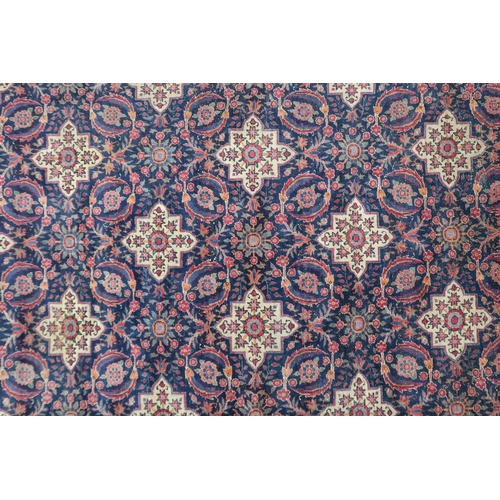 2182 - A BLUE GROUND PERSIAN FERAHAN PATTERNED RUG with all over cream medallion design on geometric floral... 