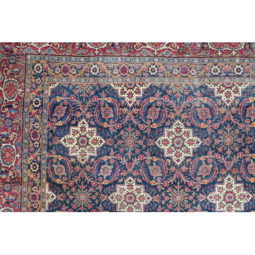 2182 - A BLUE GROUND PERSIAN FERAHAN PATTERNED RUG with all over cream medallion design on geometric floral... 