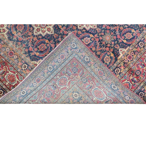 2182 - A BLUE GROUND PERSIAN FERAHAN PATTERNED RUG with all over cream medallion design on geometric floral... 