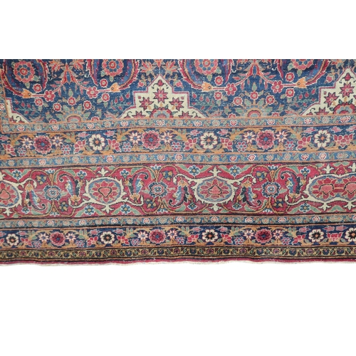 2182 - A BLUE GROUND PERSIAN FERAHAN PATTERNED RUG with all over cream medallion design on geometric floral... 