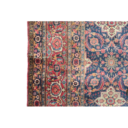 2182 - A BLUE GROUND PERSIAN FERAHAN PATTERNED RUG with all over cream medallion design on geometric floral... 