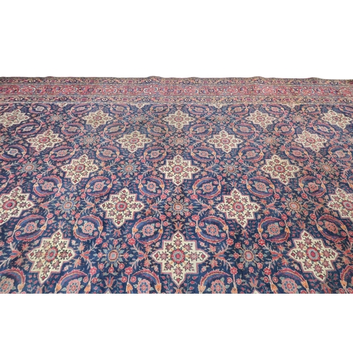 2182 - A BLUE GROUND PERSIAN FERAHAN PATTERNED RUG with all over cream medallion design on geometric floral... 