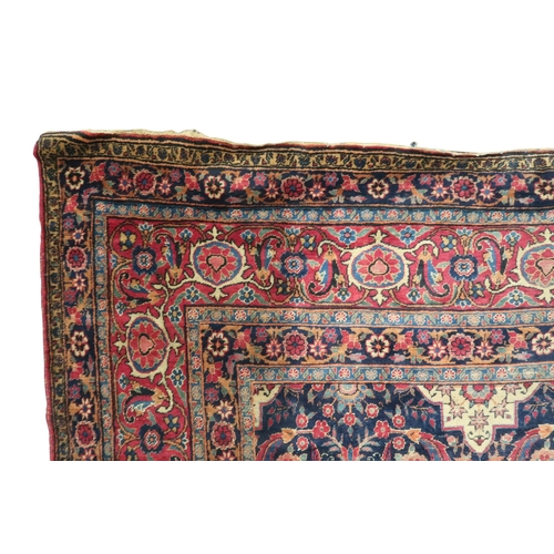 2182 - A BLUE GROUND PERSIAN FERAHAN PATTERNED RUG with all over cream medallion design on geometric floral... 