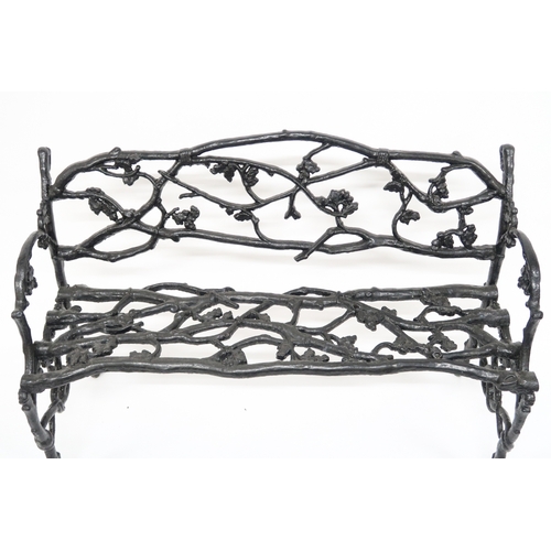 2009 - A 19TH CENTURY CAST IRON COALBROOKDALE STYLE GARDEN BENCH with black painted back, seat and sides ca... 