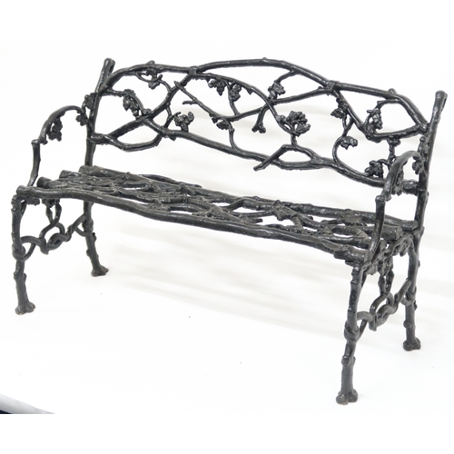 2009 - A 19TH CENTURY CAST IRON COALBROOKDALE STYLE GARDEN BENCH with black painted back, seat and sides ca... 