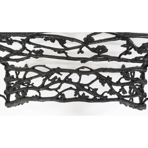 2009 - A 19TH CENTURY CAST IRON COALBROOKDALE STYLE GARDEN BENCH with black painted back, seat and sides ca... 