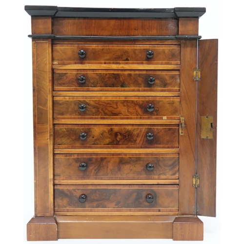 2010 - A VICTORIAN WALNUT VENEERED APPRENTICE STYLE WELLINGTON CHEST with inverted breakfront cornice over ... 