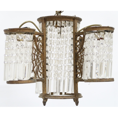 2014 - A 19TH CENTURY GILT BRASS SECTIONAL BASKET CHANDELIER with central cylindrical basket flanked on fou... 