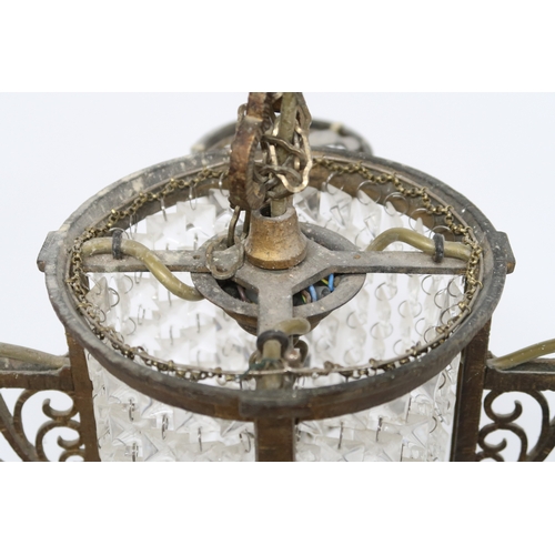 2014 - A 19TH CENTURY GILT BRASS SECTIONAL BASKET CHANDELIER with central cylindrical basket flanked on fou... 