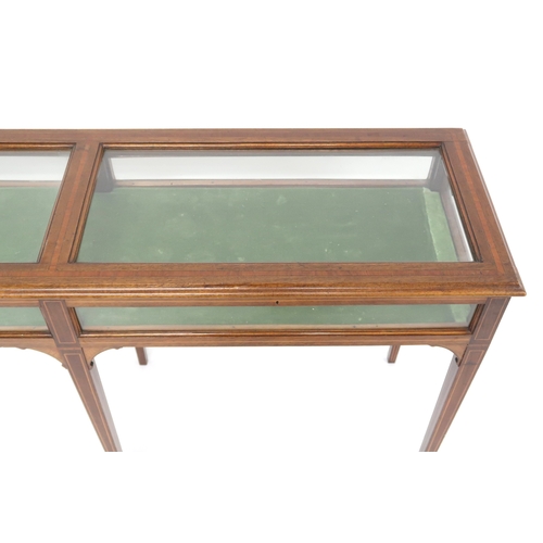 2017 - AN EDWARDIAN MAHOGANY  BIJOUTERIE TABLE with glazed hinged top and sides concealing green velvet lin... 