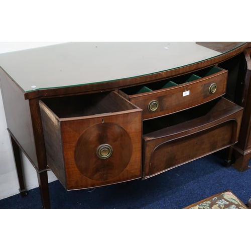 111 - A late Victorian bow front sideboard with two central drawers flanked by cabinet doors on square tap... 