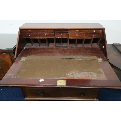 112 - A 19th century mahogany fall front writing bureau with fitted writing compartment over four drawers ... 