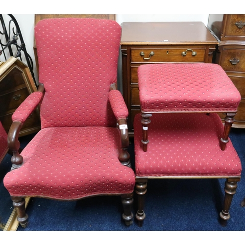 128 - A lot comprising an upholstered open armchair and two assorted upholstered footstools (3)