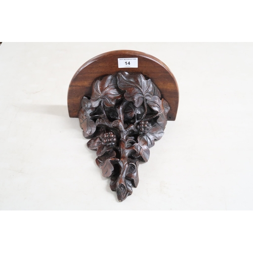 14 - A 19th century mahogany wall sconce extensively carved with acanthus leaves and berries on branch, 2... 