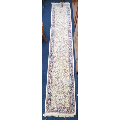 16 - An ivory ground full pile cashmere runner with floral/foliate allover tree of life design decorated ... 