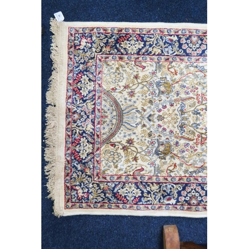 16 - An ivory ground full pile cashmere runner with floral/foliate allover tree of life design decorated ... 