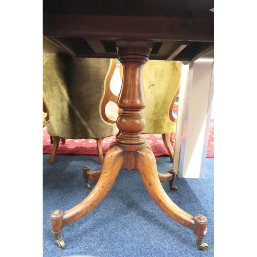 22 - A 19th century mahogany tilt top table with rectangular tilt top on turned pedestal quadrupedal base... 